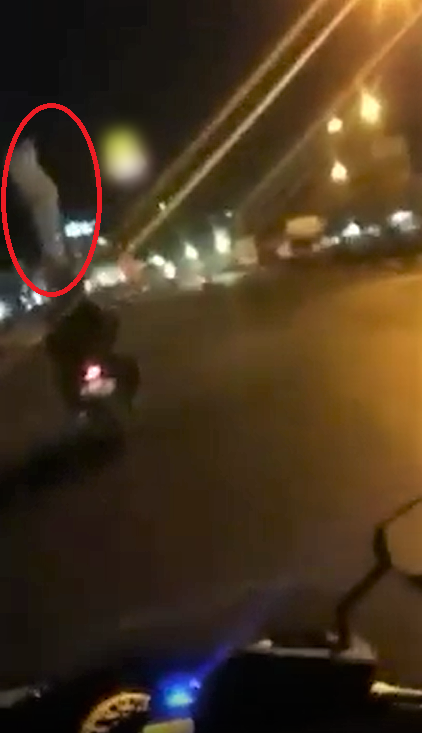 Watch: "Pocong" Hitches A Ride On Motorcyclist's Head, Netizens Are Freaked Out - WORLD OF BUZZ
