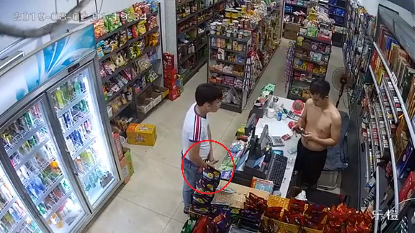 Watch: Would-Be Robber Pulls Out Knife, Shopkeeper Takes Out A Half-Metre-Long Parang In Return - World Of Buzz 1
