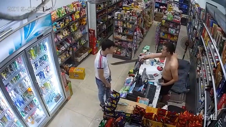 Watch: Would-Be Robber Pulls Out Knife, Shopkeeper Takes Out A Half-Metre-Long Parang In Return - World Of Buzz 3