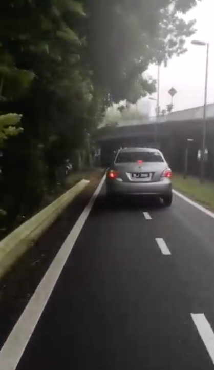 Reckless Driver Drives Car In The Motorcycle Lane Along Federal Highway - World Of Buzz 1