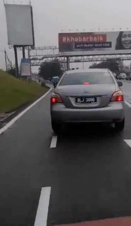 Reckless Driver Drives Car In The Motorcycle Lane Along Federal Highway - World Of Buzz 2