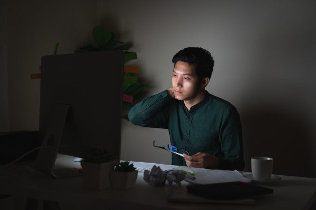 attractive young asian man working late dark night looking laptop 1439 166