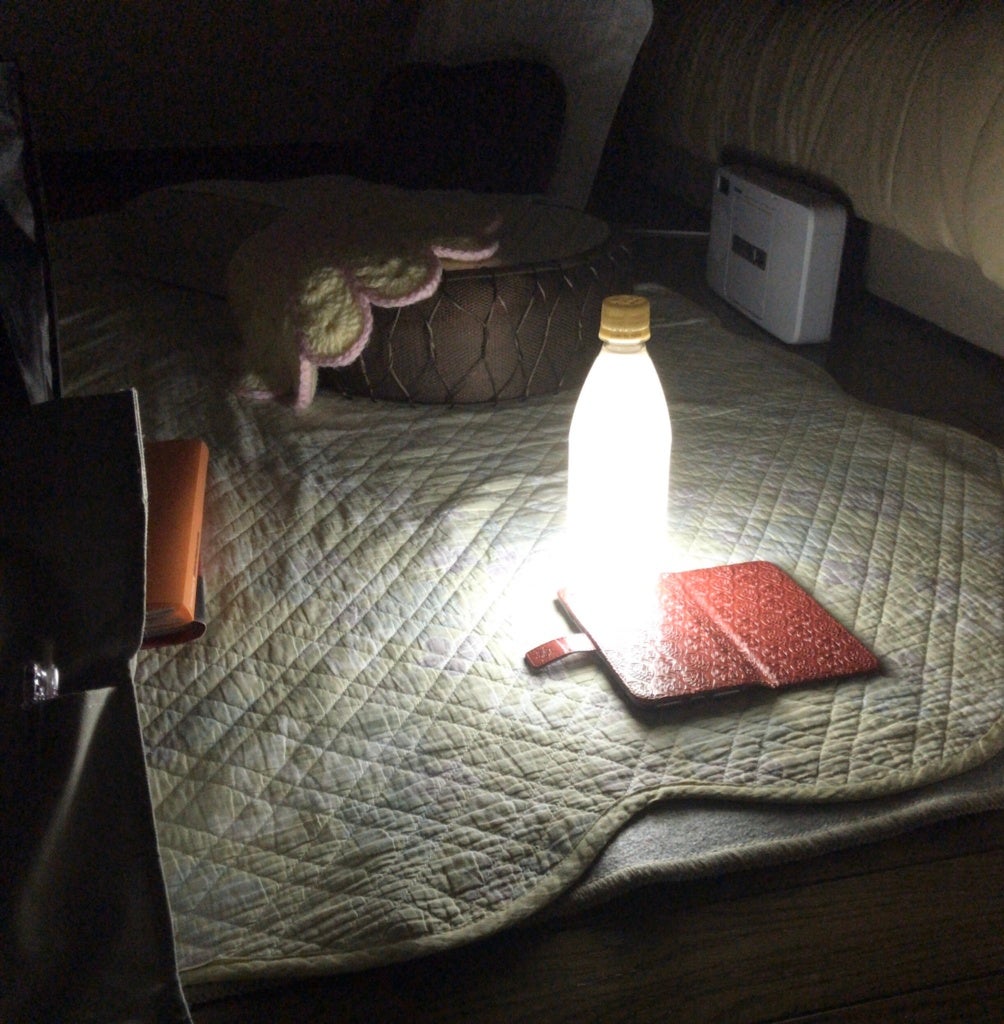 Man Uses Water Bottle, Milk And Smartphone To Make Lamp After Super Typhoon Knocked Out Power In Japan - WORLD OF BUZZ 2