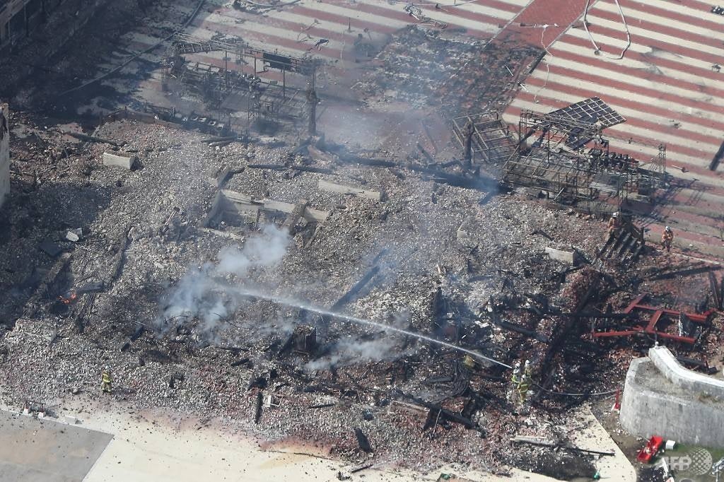 this aerial picture shows the smouldering remains of shuri castle