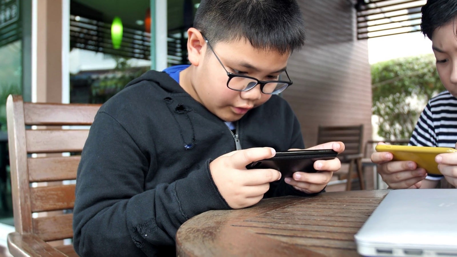 Videoblocks Slow Motion 4K Happy Asian Boy Playing Mobile Game Online On Smart Phone Together Boy And Friend Confer With Strategy Having Fun Hnygoa3Tq Thumbnail Full01