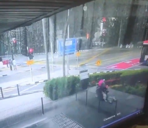 Watch: Motorcyclist Mercilessly Dragged Woman Through Asphalt Driveway in KL to Steal Her Purse - WORLD OF BUZZ 1