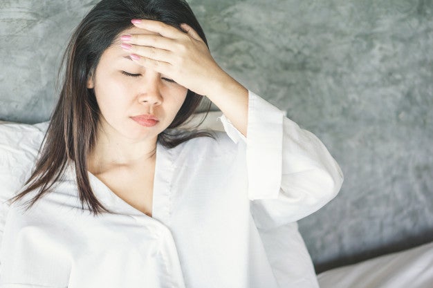 asian woman wake up with headache dizzy 34670 754