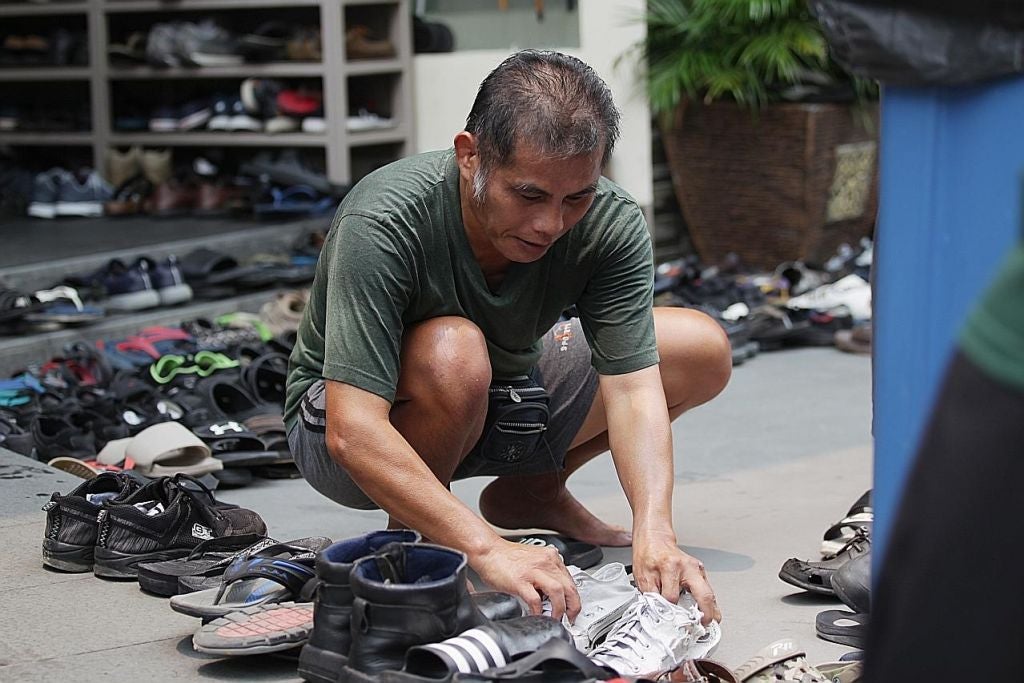 kind cheerful sg uncle help arrage shoes at mosque - WORLD OF BUZZ