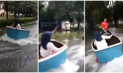 Teenagers Enjoy Monsoon Season By Making Makeshift Wake Board Out Of A Plastic Container - World Of Buzz 1