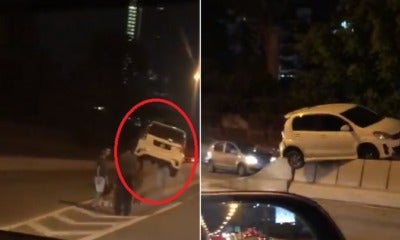 Video: &Quot;Flying&Quot; Myvi Gets Stuck On Top Of Divider At Jb, Netizens Amazed - World Of Buzz 2
