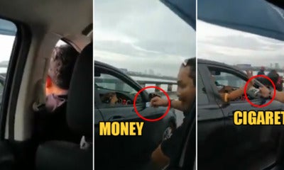 Watch: M'Sian Man Stuck In Jam Needs A Puff So Badly, Asks Passing Driver For A Cigarette - World Of Buzz