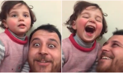 Father Creates Laughing Game To Distract Adorable Daughter From Explosions In Their City - World Of Buzz