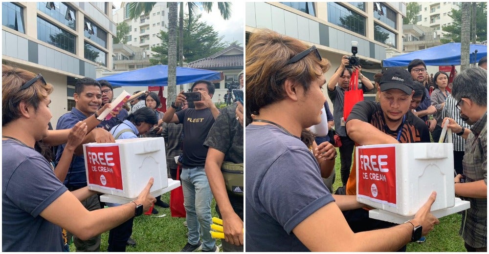Photos: TuneTalk Gives Ice Cream, Water & Umbrellas To Tired Media As They Await Political Results - WORLD OF BUZZ 2