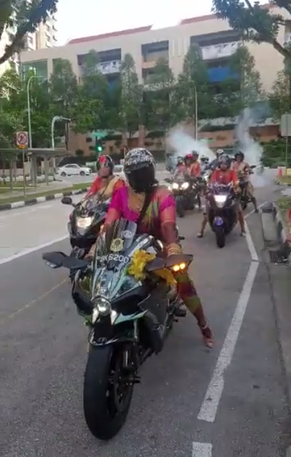 Watch: Badass Bride in Pink Saree Leads Motorcycle Convoy to Her Own Wedding on a Kawasaki - WORLD OF BUZZ