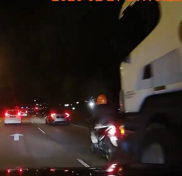 Watch: Biker Barely Escapes Getting Run Over By A Huge Truck - WORLD OF BUZZ 1
