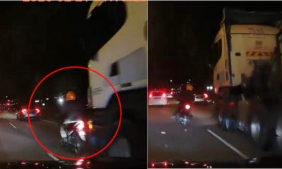 Watch: Biker Barely Escapes Getting Run Over By A Huge Truck - World Of Buzz 3
