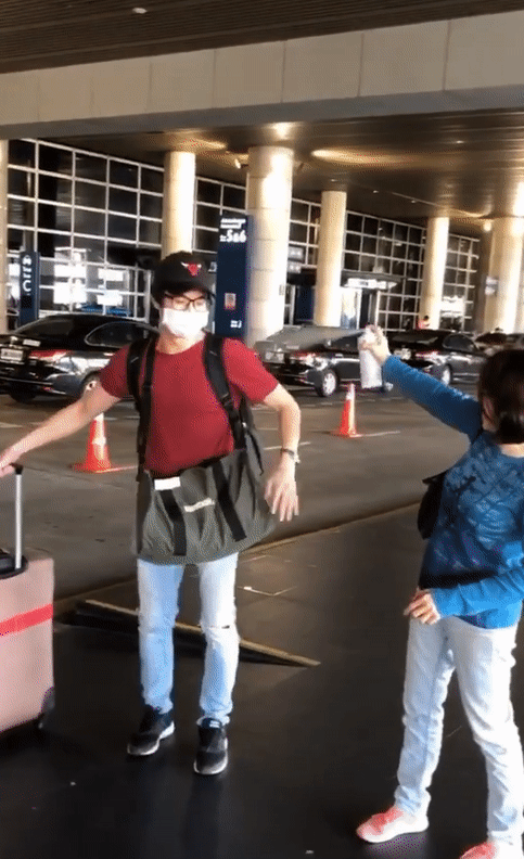 Video: M'sian Mum Welcomes Her Son Home At Airport By Hilariously Spraying Him With Disinfectant - World Of Buzz