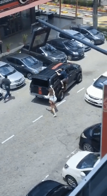 Watch: Johor Man Desperately Clings To His Car After Bank Staff Allegedly Tried Driving Away To Repossess It - WORLD OF BUZZ