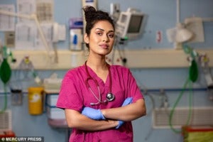 26332878 8173033 Bhasha in her scrubs while working as a junior doctor before her a 3 1585679456203