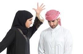 arab couple with a woman arguing to her husband isolated on a white background stock photo csp17642728