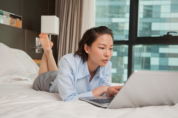 woman working on laptop in hotel eqmjyv