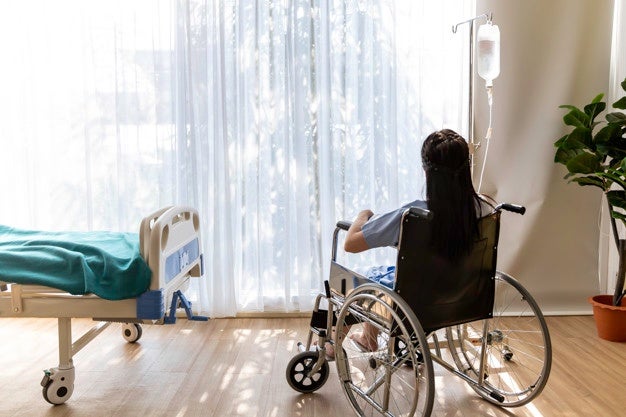 asian woman patient sitting wheelchair hospital room 53255 1262