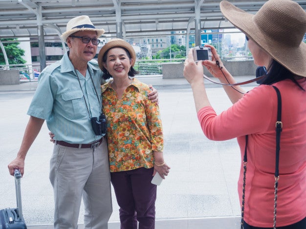 group elder people standing taking photos while traveling city 44905 1187