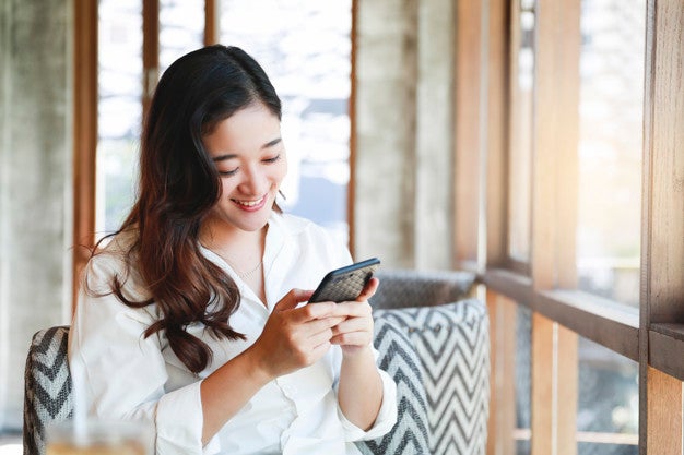 Asian Woman Smile With Mobile Phone Relaxing Cafe 112782 3