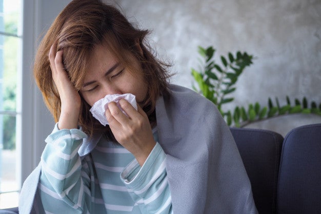 asian woman sick flu
