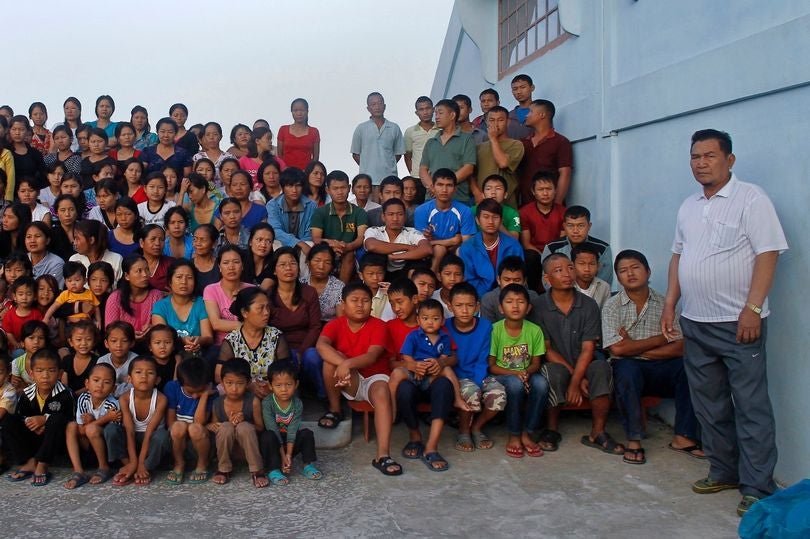 0 Family members of Ziona poses for group photograph outside their residence in village Baktawng