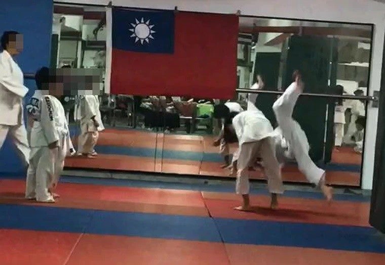 Judo coach throwing student to the ground2