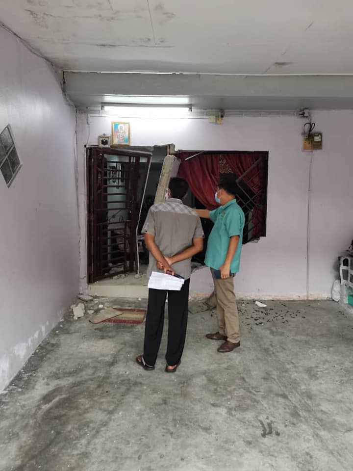 Two men inspecting house