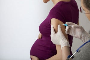 Pregnant Woman Getting Vaccine G 724233079