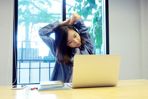 young asian woman stretching body relaxing while working with laptop computer her desk 7190 2837 1