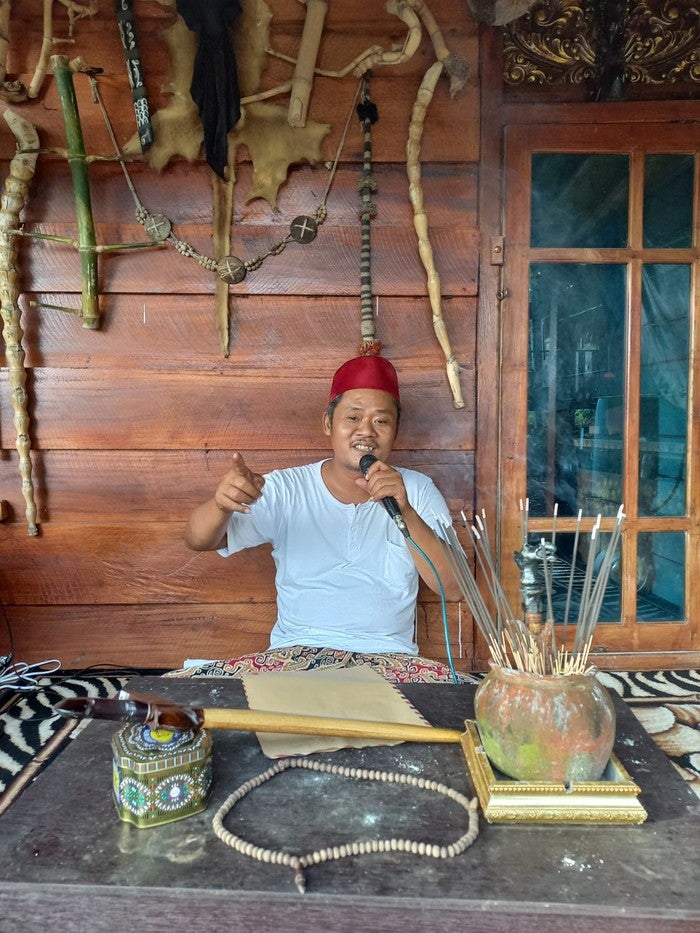indonesian bomoh holding ritual