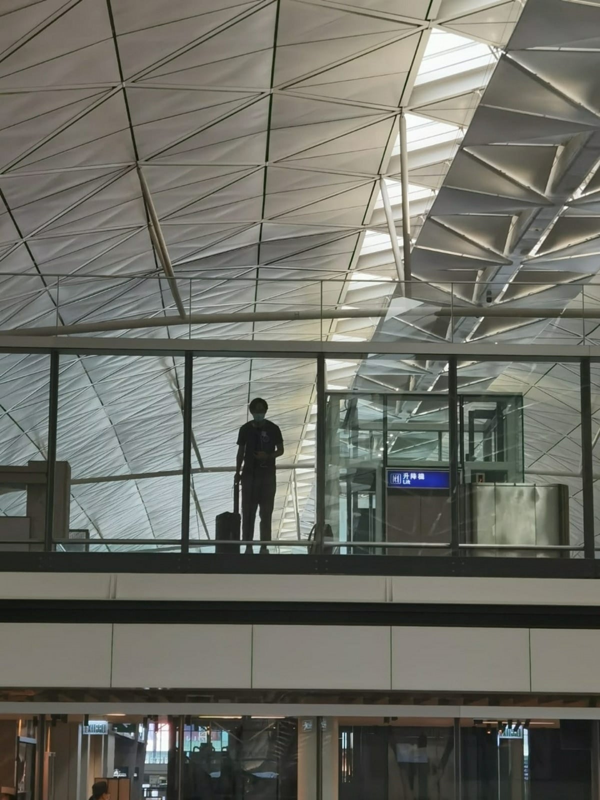 long distance couple wave in airport
