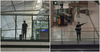 Long-Distance-Couple-Wave-To-Each-Other-In-Airport