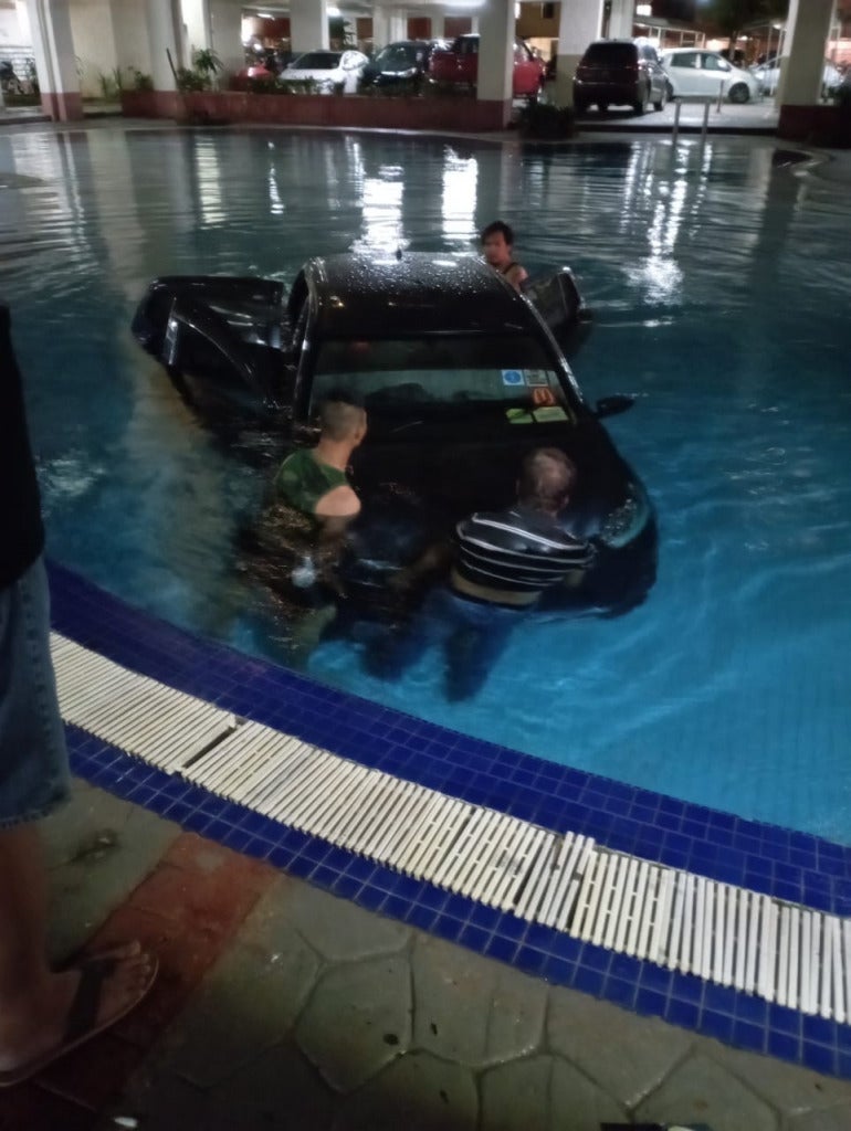 E-Hailing Driver Accidentally Steers His MyVi Into Pool of KL Condo Due ...