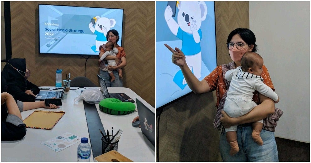 Working Mum Carrying Baby In Meeting