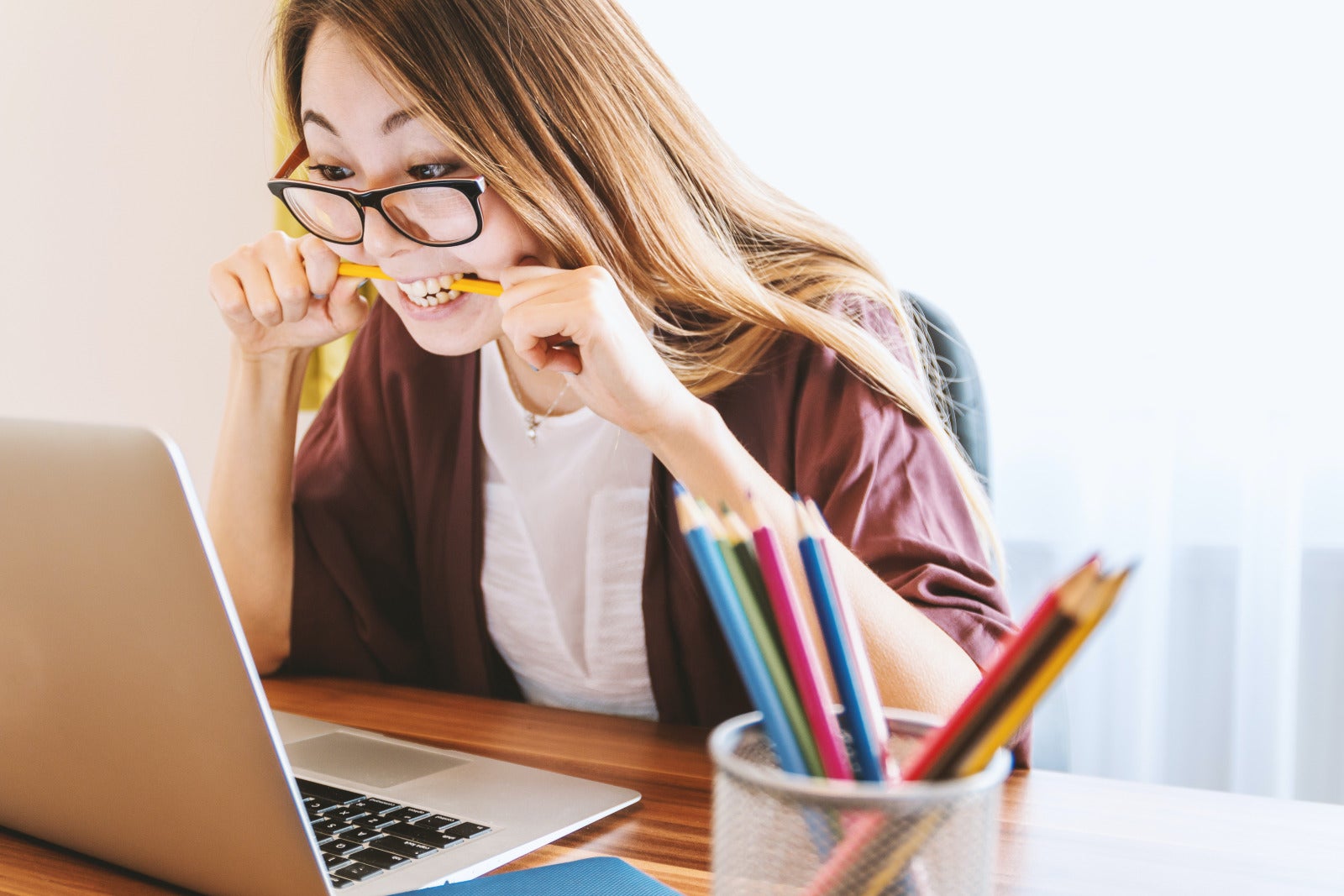 woman working on laptop angrily