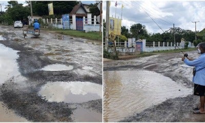 Pond Sized Pothole In Thailand