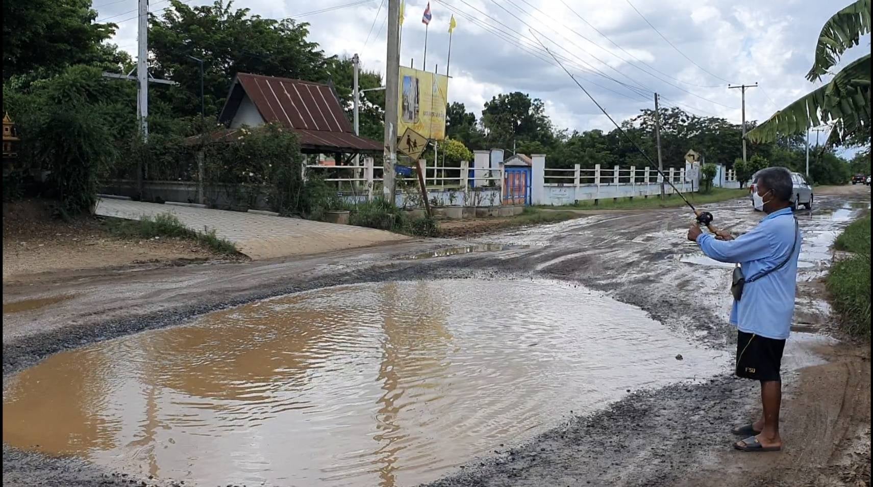 thai village potholes on road 2