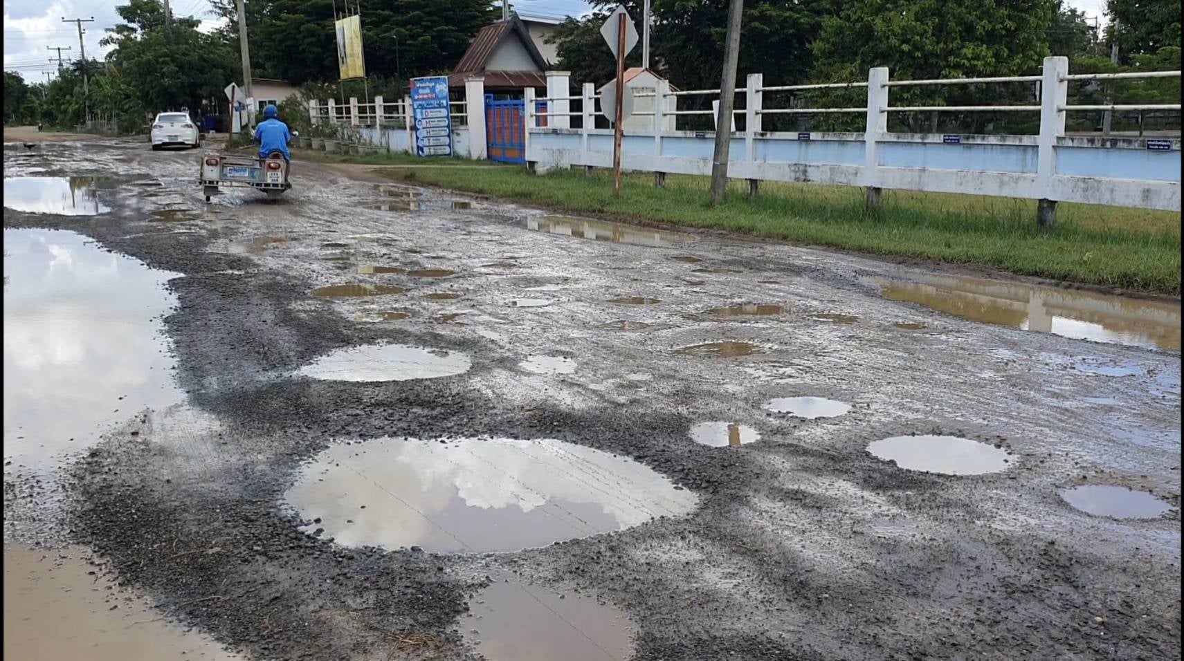 thai village potholes on road