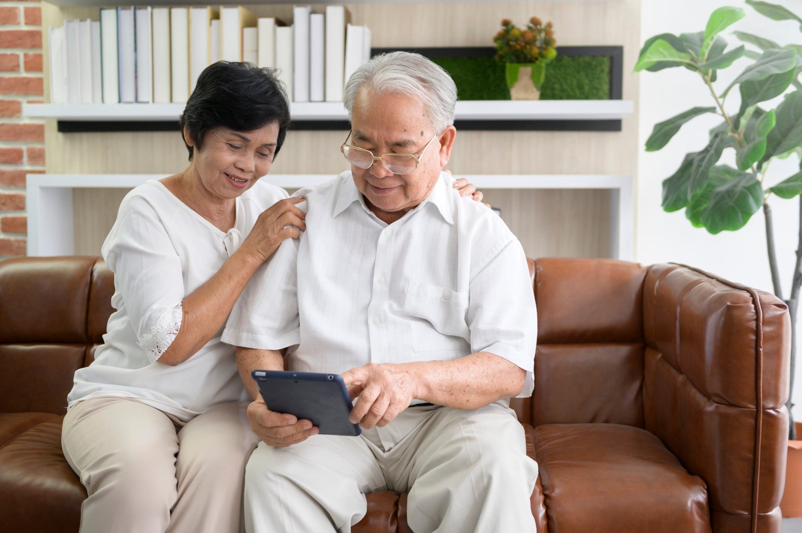vecteezy a happy senior asian couple is using tablet and talking with 599