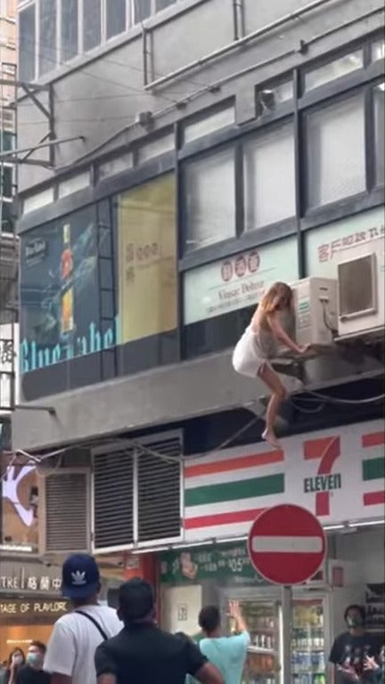 hong kong person climb ledge 1