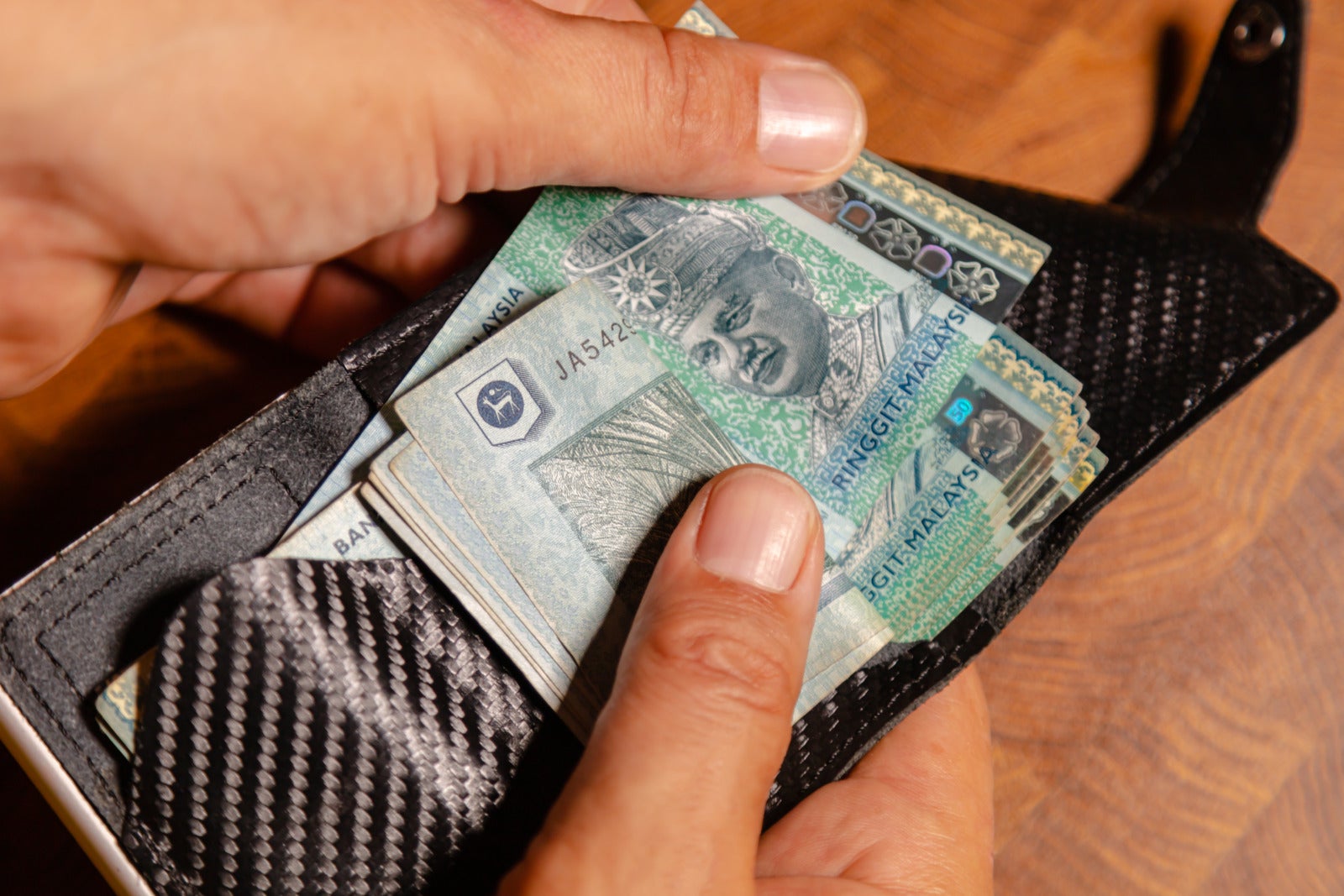Malaysian Ringgit Money Wallet Hand