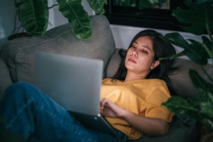 young asian woman freelancer working night living room while work home mental health health care concept