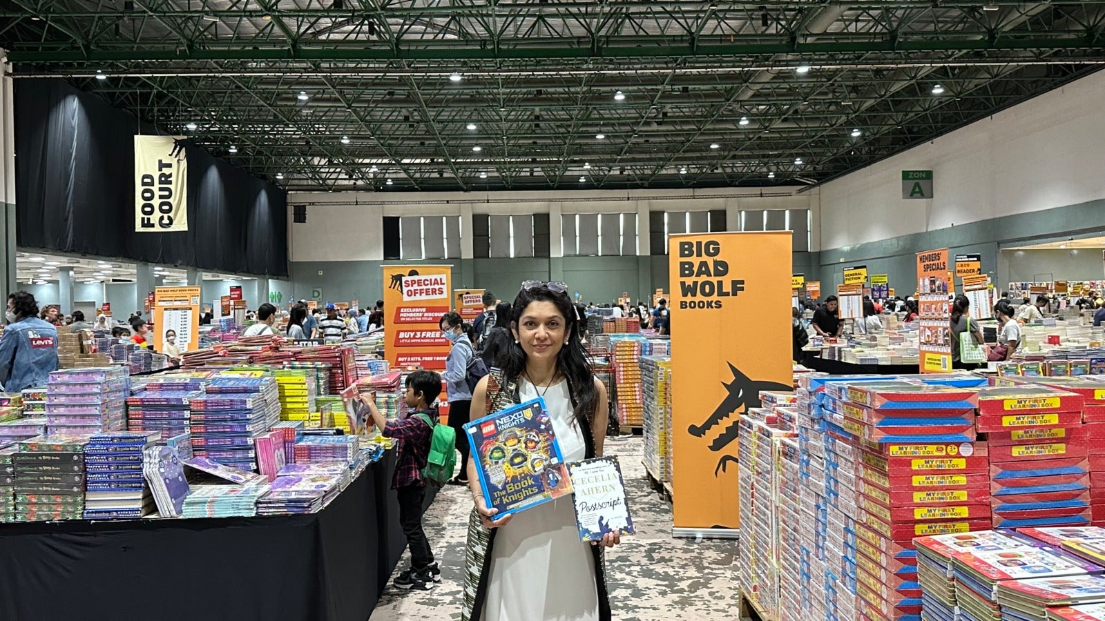 Ms Geetha Nair Head of PR at Big Bad Wolf Books showing some of the books available at the Big Bad Wolf Book Sale Kuala Lumpur 2022