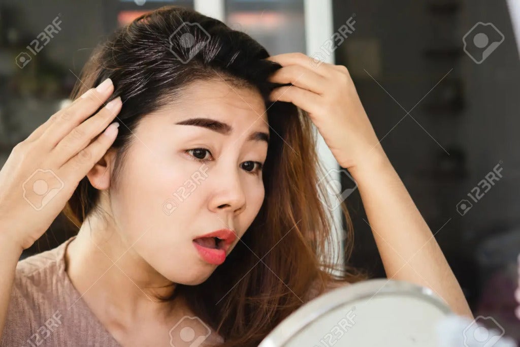 196324405 Stress Asian Woman Having Problem With Grey Hair Looking At The Mirror