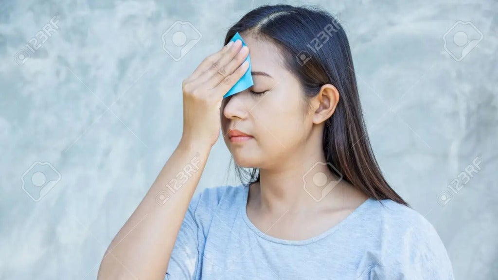 69645220 Women Use Oil Remover Paper On Her Face